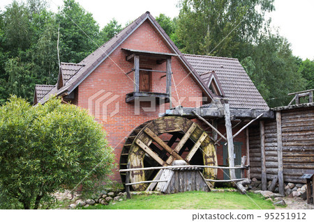 Old wooden water mill, antique style, background. Hydrotechnical Old wooden water mill, antique style, background. Hydrotechnical 95251912