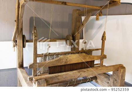 Old loom. Device for the manufacture of textile products, close-up, traditional 95252359