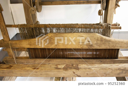 Old loom. Device for the manufacture of textile products, close-up, traditional 95252360