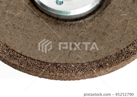 Cleaning reinforced circle on an angle grinder, close-up. Processing and cleaning of stainless steel. 95252790