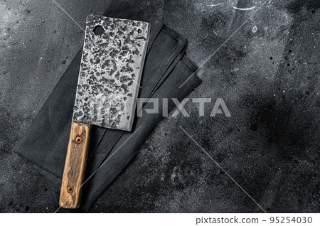 Vintage butcher meat cleaver with cloth towel. Black background. Top view. Copy space Vintage butcher meat cleaver with cloth towel. Black background. Top view. Copy space 95254030