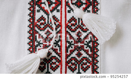 Handmade embroidery on Ukrainian shirt. Geometric ornaments, ancient traditional authentic clothes 95254257