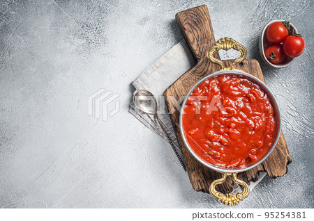 Classic Italian tomato sauce with basil for pasta and pizza in skillet. White background. Top view. Copy space Classic Italian tomato sauce with basil for pasta and pizza in skillet. White background. Top view. Copy space 95254381