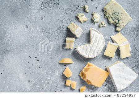 Assortment of cheese. Camembert, brie, blue cheese, parmesan. Gray background. Top view. Copy space Assortment of cheese. Camembert, brie, blue cheese, parmesan. Gray background. Top view. Copy space 95254957