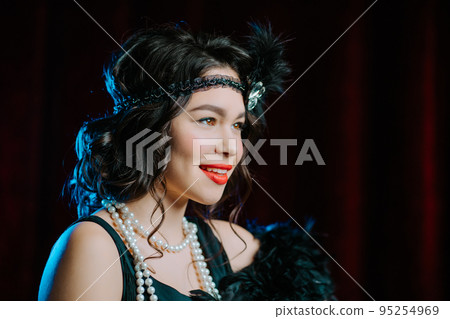 Amazing portrait of brunette woman dressed in style of 20th last century on velours background Amazing portrait of brunette woman dressed in style of 20th last century on velours background 95254969