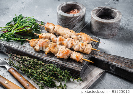 Grilled shish kebab with Chicken meat, poultry skewers with salad. Gray background. Top view Grilled shish kebab with Chicken meat, poultry skewers with salad. Gray background. Top view 95255015