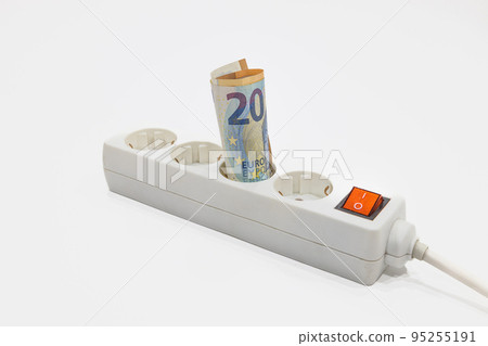 Euro banknotes plugged into the power strip. Concept of expensive electricity prices Euro banknotes plugged into the power strip. Concept of expensive electricity prices 95255191