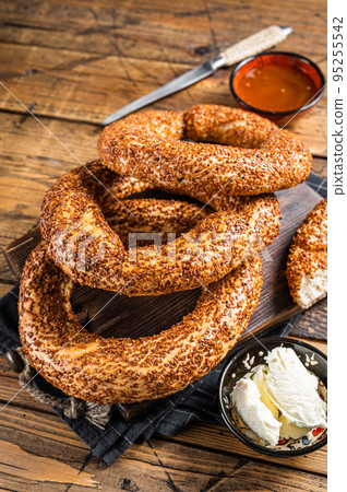 Traditional turkish breakfast with Bagel Simit, kaymak and honey. Wooden background. Top view 95255542