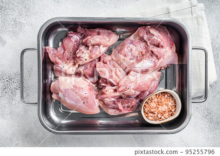 Ready for cooking lamb whole shoulder, raw leg meat on a grill pan with spices. Black background. Top view Ready for cooking lamb whole shoulder, raw leg meat on a grill pan with spices. Black background. Top view 95255796