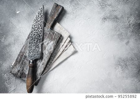 Hatchets for meat, Vintage butcher meat cleaver with cloth towel on wooden board. White background. Top view. Copy space 95255892
