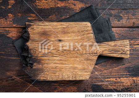 Empty wooden Cutting board over towel on kitchen table, healthy cooking background. Wooden background. Top view. Copy space 95255901