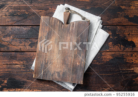 Directly Above view Of Cutting Board On dark Wooden Table. Wooden background. Top view. Copy space Directly Above view Of Cutting Board On dark Wooden Table. Wooden background. Top view. Copy space 95255916