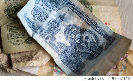 Old Russian ruble paper banknote. Old banknotes of the former Soviet Union. USSR. 5 ruble money of the Soviet Union. Selective focus Old Russian ruble paper banknote. Old banknotes of the former Soviet Union. USSR. 5 ruble money of the Soviet Union. Selective focus 95257340