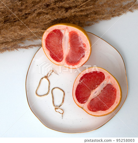 Woman's jewelry. Flat lay composition. Earrings 95258003