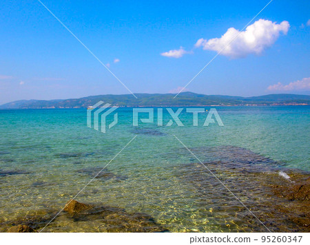 Summer seascape beautiful waves, blue sea water in sunny day. Top view from drone. Sea aerial view, amazing tropical nature background. Beautiful bright sea with waves splashing and beach sand concept Summer seascape beautiful waves, blue sea water in sunny day. Top view from drone. Sea aerial view, amazing tropical nature background. Beautiful bright sea with waves splashing and beach sand concept 95260347