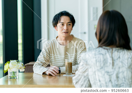 young couple saying goodbye young couple saying goodbye 95260663