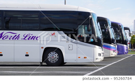 Tourist bus in parking lot Tourist bus in parking lot 95260784