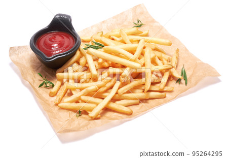 French fries potatoes on parchment paper isolated on white background French fries potatoes on parchment paper isolated on white background 95264295