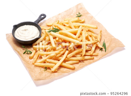 French fries potatoes on parchment paper isolated on white background 95264296