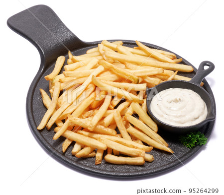 French fries potatoes on black ceramic serving board or dish isolated on white background French fries potatoes on black ceramic serving board or dish isolated on white background 95264299