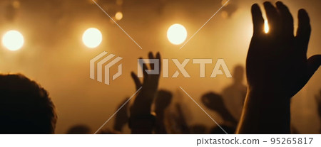 Blurry background picture of hand reaching out for God's help, good for your multimedia content background 95265817