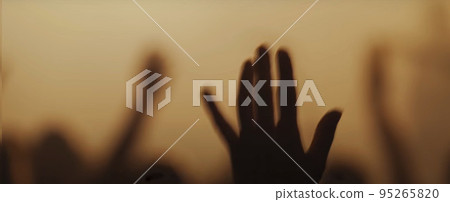 Blurry background picture of hand reaching out for God's help, good for your multimedia content background 95265820