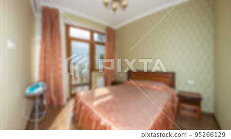 Defocused and blurred photo of luxury and modern bedroom with sea view in hotel apartment interior design. Ideal for background. Defocused and blurred photo of luxury and modern bedroom with sea view in hotel apartment interior design. Ideal for background. 95266129