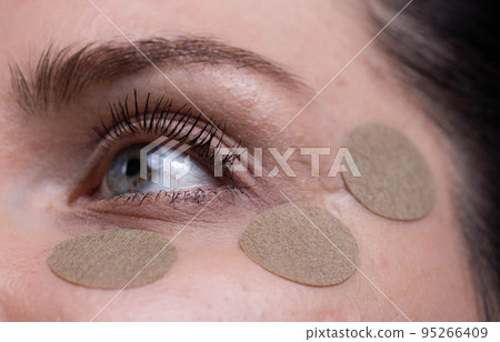 Medical patch for the girl around the eyes. Relieve fatigue and stress, improve vision, macro Medical patch for the girl around the eyes. Relieve fatigue and stress, improve vision, macro 95266409