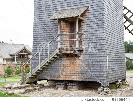 Staircase with door and entrance in an old wooden mill, traditional Staircase with door and entrance in an old wooden mill, traditional 95266444