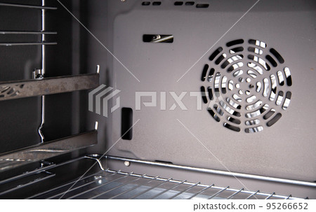 Modern electric oven with telescopic rails, top and bottom heat. Function 3D hot air, thermal grill and convection. Close-up 95266652