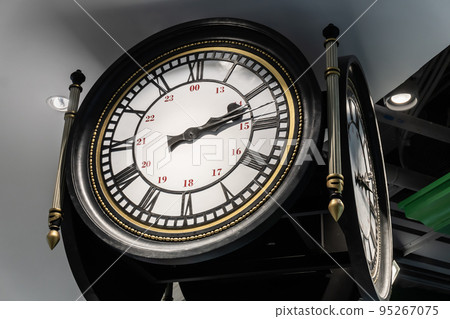 Large vintage clock with Arabic and Roman numerals. 95267075