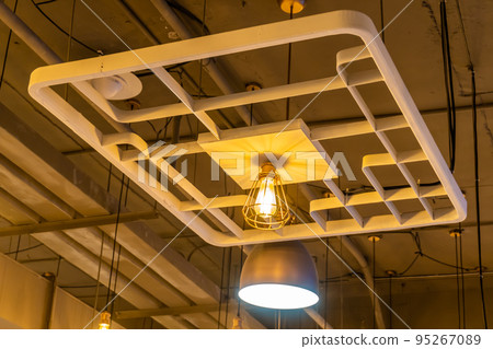 Antique lamps decorate the interior of the building, giving off a warm yellow glow. 95267089