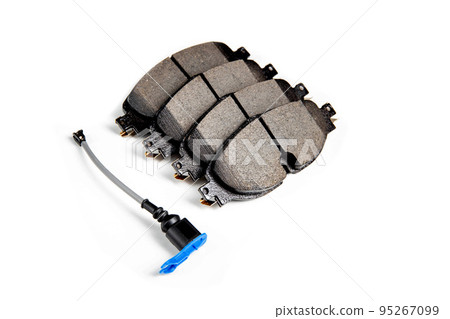 Set of brake pads with a wear indicator on a white background, isolate. Wear sensor for brake pads Set of brake pads with a wear indicator on a white background, isolate. Wear sensor for brake pads 95267099