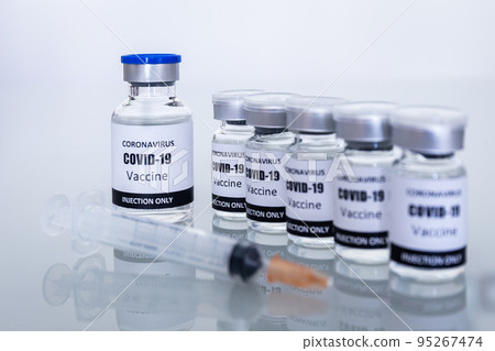 Many Vaccine bottles and syringes for preventing coronavirus or covid-19. Select focus Many Vaccine bottles and syringes for preventing coronavirus or covid-19. Select focus 95267474