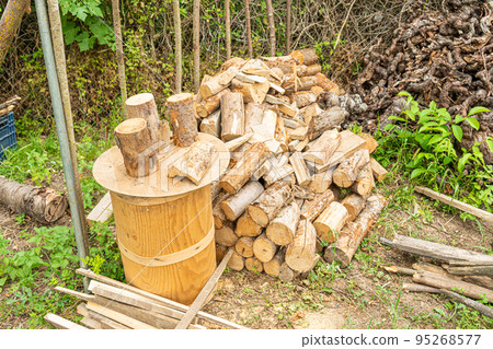 Pile of cut wood in the garden Pile of cut wood in the garden 95268577