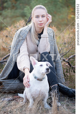 Young attractive woman playing with dog 95269352