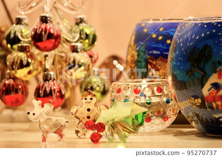 Image of Christmas: Christmas tree, ginger cookies and reindeer glass miscellaneous goods on the table Image of Christmas: Christmas tree, ginger cookies and reindeer glass miscellaneous goods on the table 95270737