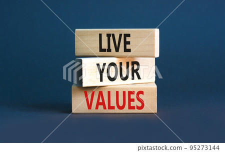 Live your values symbol. Concept words Live your values on wooden blocks. Beautiful grey table grey background. Business, psychological and live your values concept. Copy space. 95273144