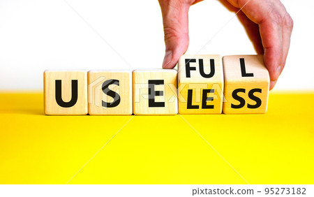 Useful or useless symbol. Concept words Useful or Useless on wooden cubes. Businessman hand. Beautiful yellow table white background. Business useful or useless concept. Copy space. Useful or useless symbol. Concept words Useful or Useless on wooden cubes. Businessman hand. Beautiful yellow table white background. Business useful or useless concept. Copy space. 95273182