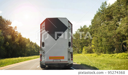 Truck with a special semi-trailer glass carrier. Transportation of glass and double-glazed windows with a large weight. Truck with a special semi-trailer glass carrier. Transportation of glass and double-glazed windows with a large weight. 95274368