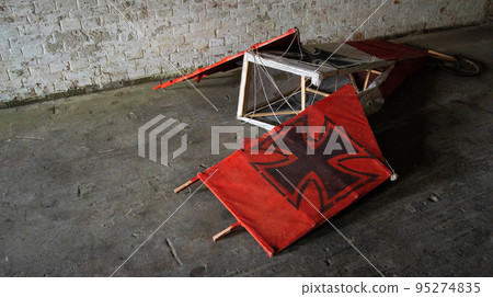 A destroyed German pennant lies on the floor during the war, banners 95274835