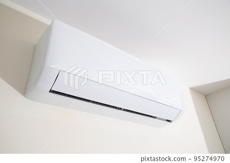Wall mounted air conditioner in a modern apartment. The concept of maintaining a comfortable room temperature. Close-up 95274970