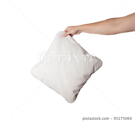 Gray pillow in a man's hand on a white background, isolate. Close-up Gray pillow in a man's hand on a white background, isolate. Close-up 95275069