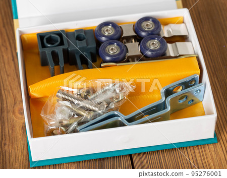 set of roller mechanism for sliding doors. Door furniture, close-up set of roller mechanism for sliding doors. Door furniture, close-up 95276001