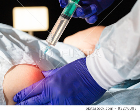 The doctor injects an anti-inflammatory drug into the shoulder joint to treat shoulder pain and atrosis. Plasma therapy and chondroprotectors for the restoration of cartilage and synovial fluid The doctor injects an anti-inflammatory drug into the shoulder joint to treat shoulder pain and atrosis. Plasma therapy and chondroprotectors for the restoration of cartilage and synovial fluid 95276395