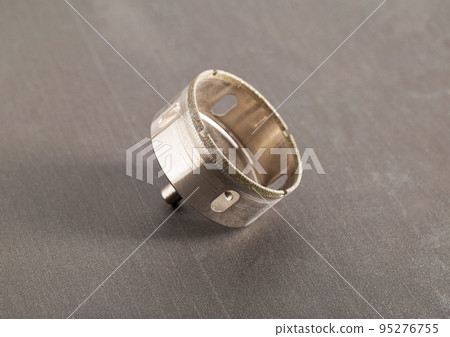 Diamond crown for holes in porcelain stoneware, granite and tiles on a gray background. Close-up, instrument 95276755