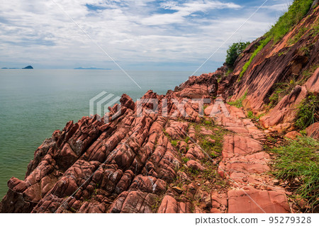 beautiful pink arkosic sandstone or rock cliff by sea, Chanthaburi 95279328
