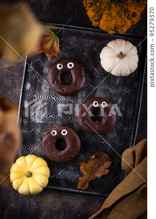 Halloween festive donuts with eyes. 95279370