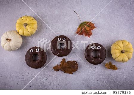 Halloween festive donuts with eyes. Halloween festive donuts with eyes. 95279386