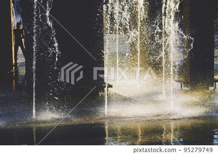 Cool water fountains flow in the summer heat Cool water fountains flow in the summer heat 95279749